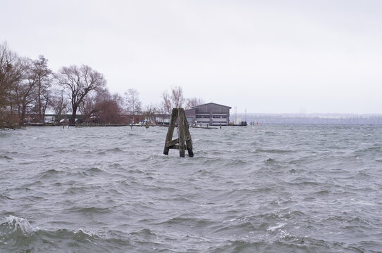 Rough waves on Schwerin Lake during windy winter weather in Germany