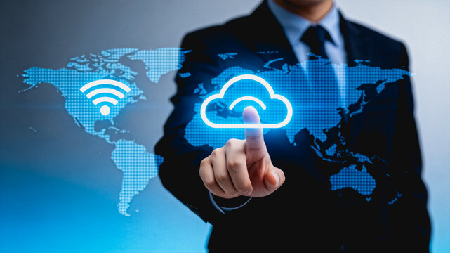 Businessman Tapping Cloud Computing Network on Global Digital Map