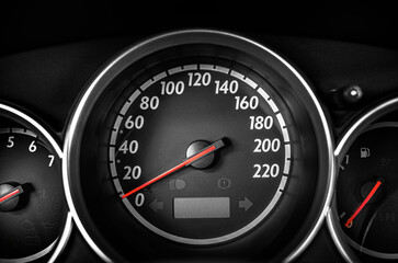 Fototapeta premium Car speedometer displaying the dashboard instrumentation panel with a red indicator needle.