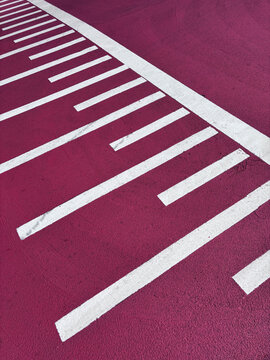 white lines on pink asphalt road