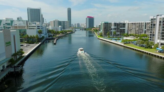 Aerial View of Boat Traveling Through Hollywood Beach Waterway with Florida Waterfront Skyline