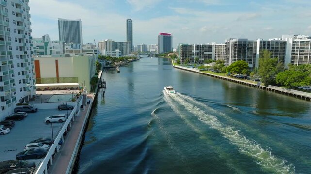 Aerial View of Boat Traveling Through Hollywood Beach Waterway with Florida Waterfront Skyline