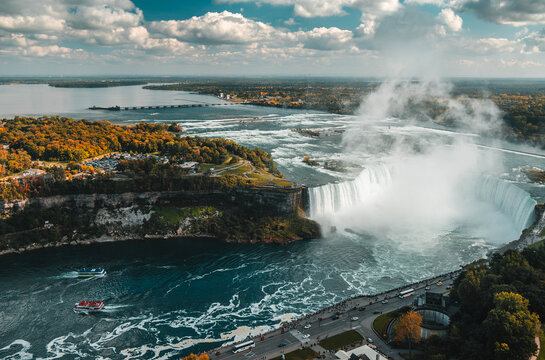 Niagara Falls waterfall cascading over rocky cliff edge with powerful flowing water motion