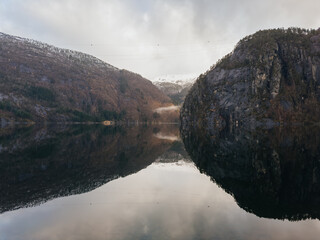 Scenic view of Norwegian fjord with mountain reflection in calm water © Olga
