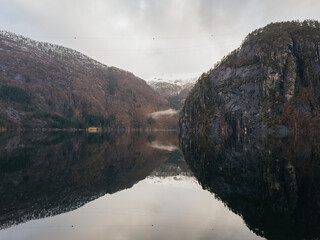 Scenic view of Norwegian fjord with mountain reflection in calm water © Olga