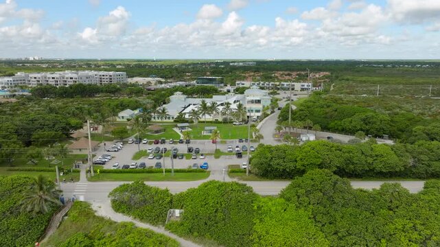 Aerial View of Juno Beach Florida Shoreline With Turquoise Ocean, Sand and Beach Umbrellas