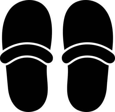 Pair of simple black slippers resting together during a studio shoot isolated on transparent background