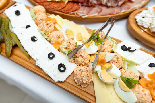 Close up shot of Serbian traditional cold appetizer board with feta cheese urnebes and eggs
