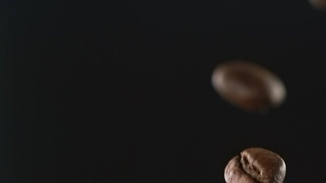 Coffee beans falling through the air in slow motion