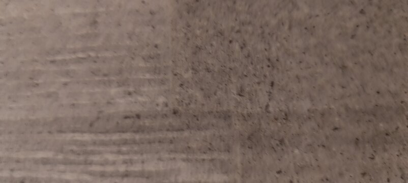 Slow panning shot of grunge concrete texture background with deep scratches