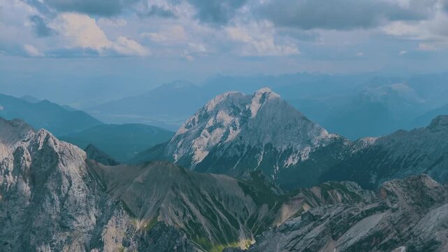 Stunning panoramic timelapse from Zugspitze, the highest peak in Germany. Majestic clouds are floating above the rugged, snow dusted Alps
