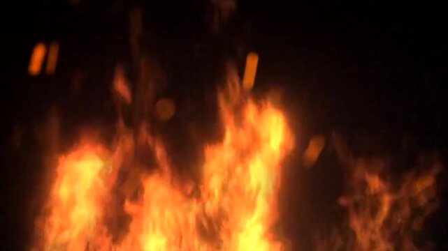 Blazing Fire Flames and Flying Sparks Motion on Black Background