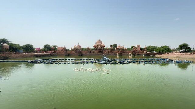 Scenic Kusum Sarovar with Historic Architecture and Water Reflection in Govardhan