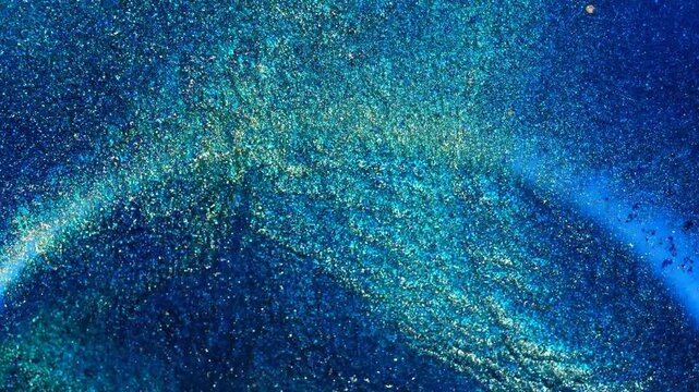 Mixing alcohol ink creates patterns in a bright setting