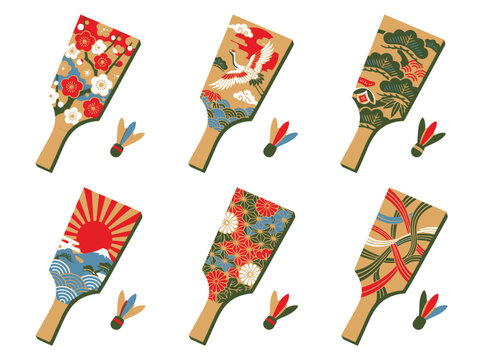 Set of traditional japanese hagoita paddles with decorative patterns and colorful shuttlecocks