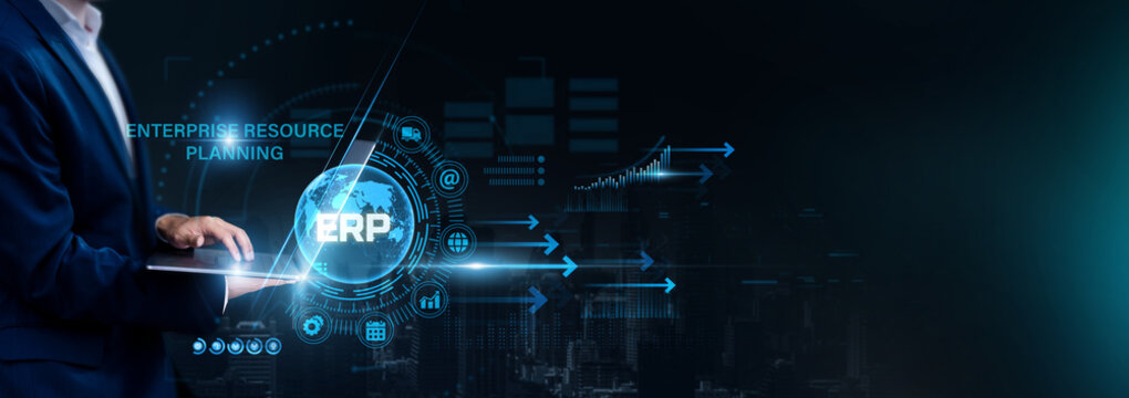 Businessman using laptop for analyzing ERP and global enterprise data, resource planning, business operations, workflow management, organizational efficiency.