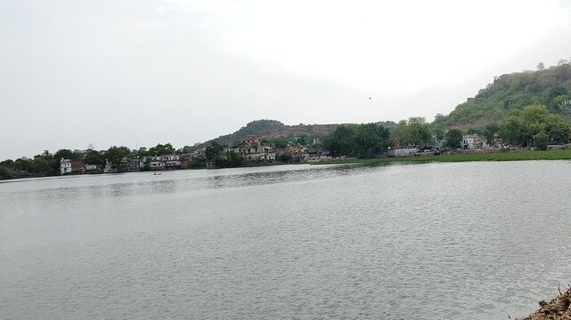 Scenic View of Lake and Surrounding Hills