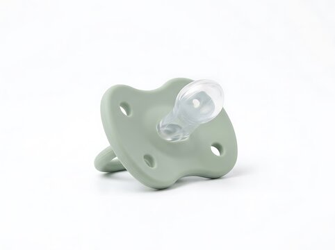 Mint green silicone baby pacifier teether isolated on white background
