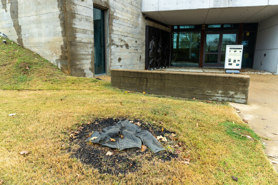 Corinth, Mississippi: Corinth Civil War Interpretive Center. Bronzed soldier's jacket among "Detritus of War" along path to visitor center entrance. 