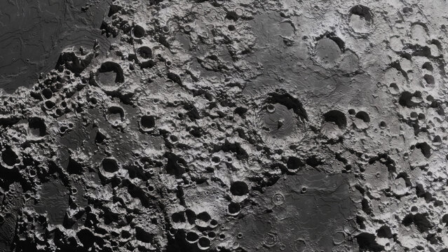Closeup lunar surface with overlapping impact craters and rugged mare plains under high contrast lighting showing detailed crater rims and ejecta, with lunar, moon, crater, impact detail