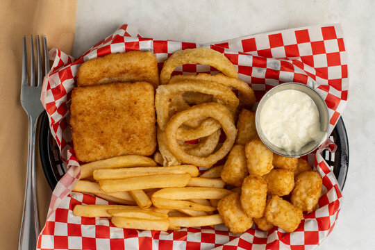 haddock fillets with onio rings, fries and tater tots