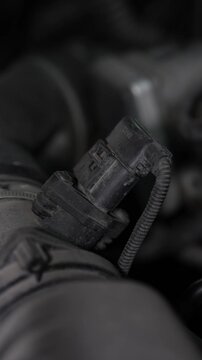 Car mass air flow sensor installed on engine intake pipe.