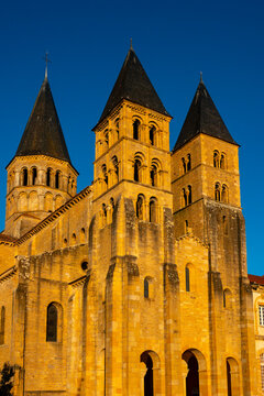 Historic Romanesque Stone Basilica of Paray-le-Monial under Blue Sky.