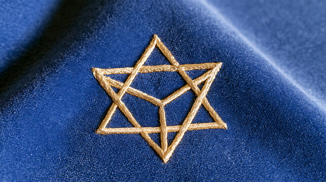 Gold hexagram star symbol embroidered on rich blue velvet fabric, elegant religious and spiritual design for sacred art and texture backgrounds
