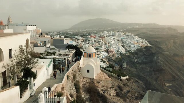 Scenic travel montage showcasing Santorini, Greece, featuring the iconic blue-domed church overlooking the caldera volcanic islands, traditional whitewashed cliffside villages