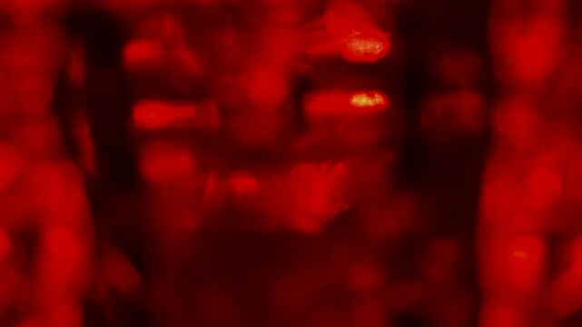 Abstract red background with glowing blurred rectangular patterns