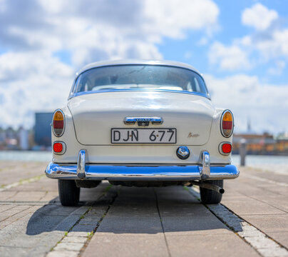 Gothenburg, Sweden - July 26 2026: Rear view of classic Volvo Amazon under clouds.