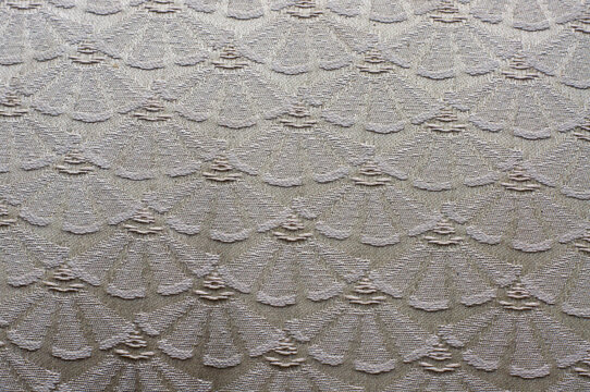 close up of antique upholstery fabric from the 1800s clamshell design