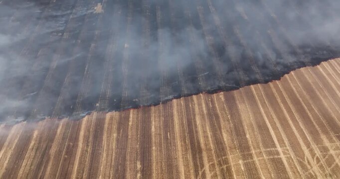 Top-down shot captures controlled burn in agricultural field