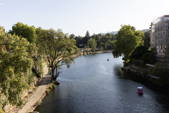 high angle view small boats sailing on the T&acirc;mega River of the town of Amarante, Portugal on a clear day