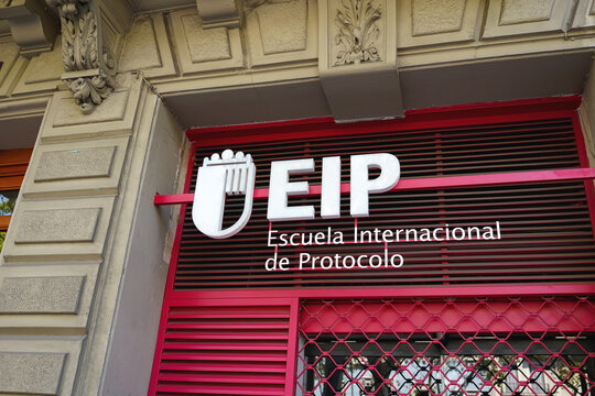 BARCELONA, SPAIN - AUGUST 23, 2026: EIP Escuela Internacional de Protocolo building facade with red and white branding s