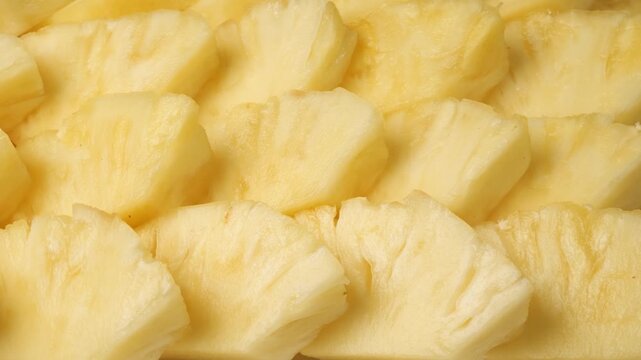 Fresh juicy sliced pineapple fruit background