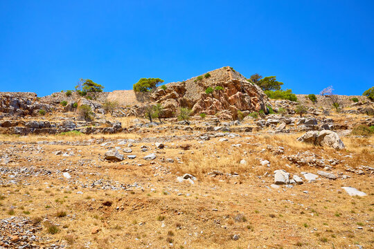 Rugged hillside under clear blue sky