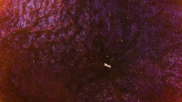 Mixing alcohol ink fragments in a macro shot