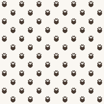 Animal paw print seamless pattern on beige background
