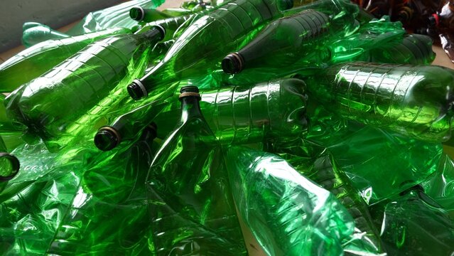 Waste PET bottles. Green plastic bottles waste. PET recycle