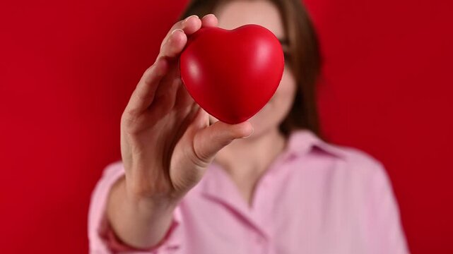 Unrecognizable Woman holds heart. Health or valentines day concept