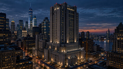 Fototapeta premium High Security Institutional Tower Illuminated in Downtown Skyline at Night