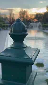 By the fountain at sunset