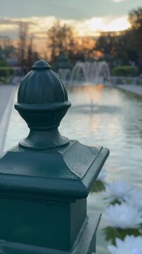 By the fountain at sunset