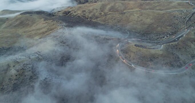 fog coming in over a mountain