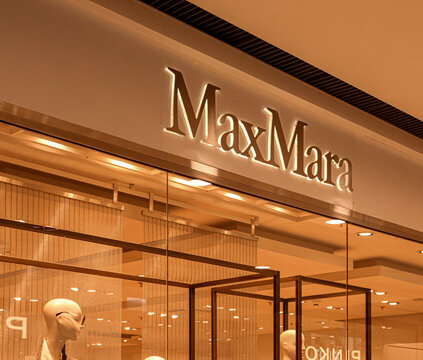 Warsaw, Poland, 20 August 2026. Max Mara boutique sign illuminated above the store entrance in Klif shopping center, Warsaw, Poland