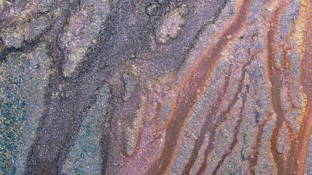 Mixing alcohol ink creates colorful patterns in close-up view