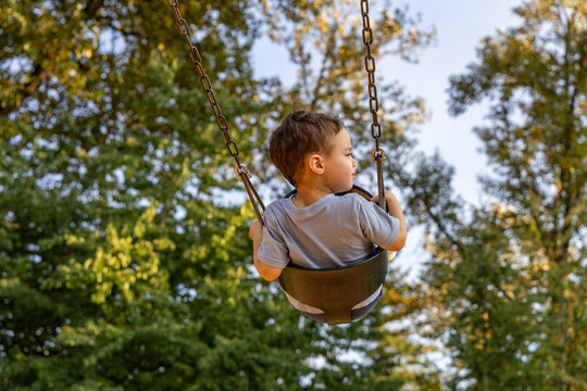 Young Boy on Swing at Vedder Park, Chilliwack, BC Canada Enjoying a Playful Outdoor Moment