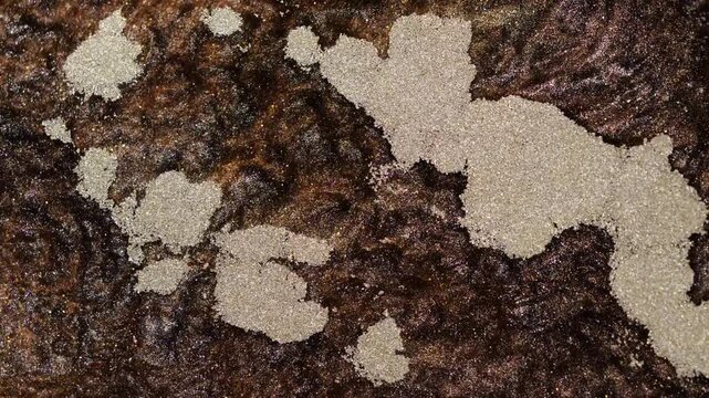 Mixing alcohol ink fragments in abstract patterns and colors