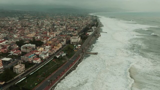 Climate change destroys a beachfront with a strong ocean storm surge aerial